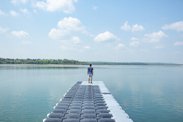 Man walking into the water