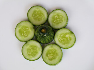 Fresh raw  sliced cucumber in white background