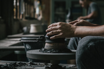Artisan potter making art pot handicraft