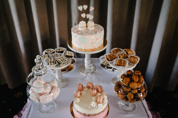 Birthday Cake on a background party decor. Copy space. Celebration concept. Trendy Cake. Candy bar. Table with sweets, candies, dessert.