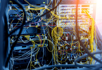 Server room with computers for internet. Network cables connected to switches.