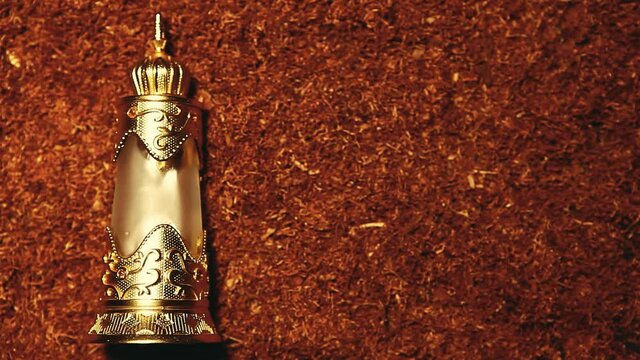 footage of glass perfume bottle tobacco background 
