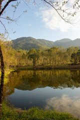 Nature looks like peaceful, quiet, fresh and beautiful reflection lake just like a mirror of mountains and trees in countryside with freshair and no people around