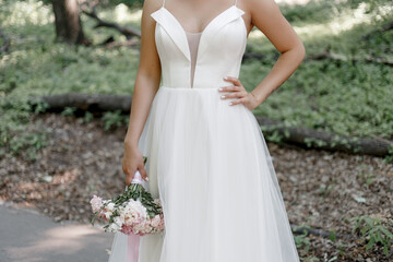 Fototapeta premium bride holding bouquet of flowers