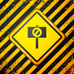 Black Protest icon isolated on yellow background. Meeting, protester, picket, speech, banner, protest placard, petition, leader leaflet Warning sign Vector