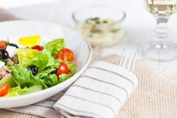 Chef's salad with tuna fish, black olives and egg in caper-mayonaisse sauce.