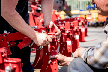 The mechanics repair combine harvester. Modern agricultural machinery