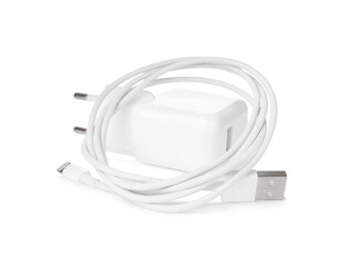 USB charge cable and power adapter on white background. Modern technology