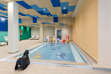 Indoor kids swimming pool in hotel spa and wellness center