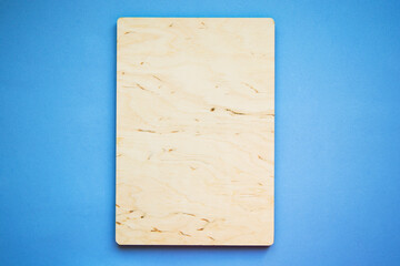 mock up empty wooden frame isolated on a blue background - 362395621