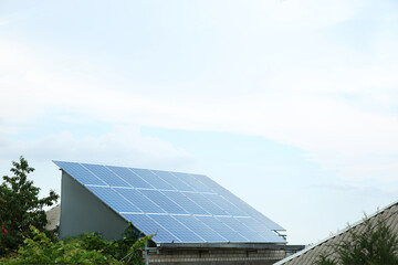 House with installed solar panels on roof. Alternative energy source