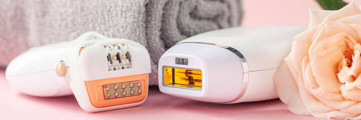 Home spa accessories - epilator and photoepilator on pink  background. Apparatus and rose as a symbol. Banner