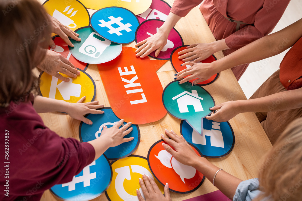 Poster hands of several friendly millennials choosing paper speech bubbles with icons