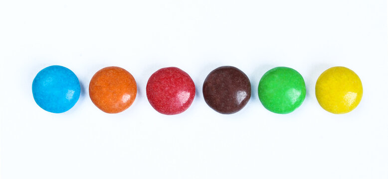 Colorful candies isolated on white background. Chocolate filled sweets in various colors