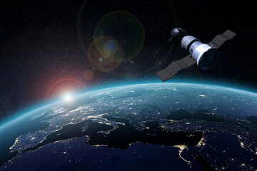 Spaceship and the Earth on the background. Elements of this image furnished by NASA