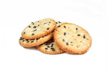 Salty crackers isolated on white background. Tasty snack with sesame seeds 