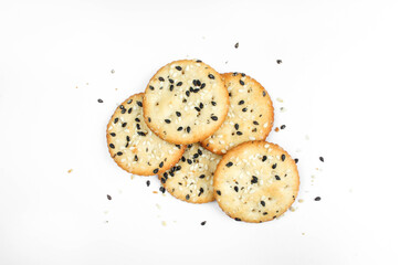 Salty crackers isolated on white background. Tasty snack with sesame seeds 