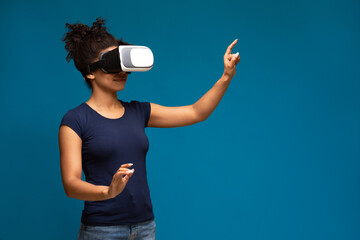 Millennial black woman using VR with sense of immersion