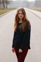 Young girl outside windy portrait