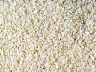 background of roasted sesame seeds close up