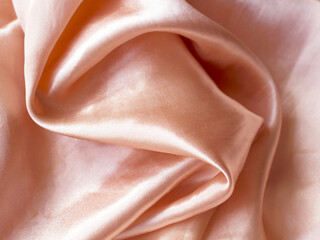 Smooth elegant pink beige golden silk wedding background. satin fabric In Sepia toned. Retro style
