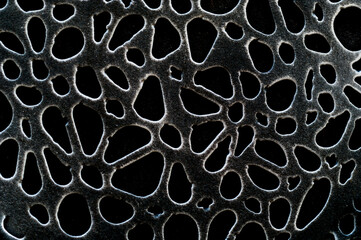 Creative wrought iron texture. Black background for design and projects.
