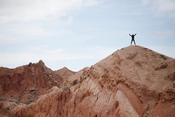 Man on the top of the mountain. Beautiful mountain landscape. Wildlife of Kyrgyzstan.
