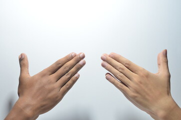 Folded Praying Hands of two person in white background