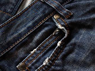 blue navy Jeans background, denim with seam of fashion design. macro close up