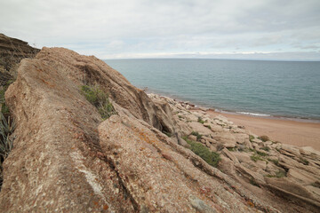 Beautiful mountain landscape. The shore of Lake Issyk-Kul. Wildlife of Kyrgyzstan. Clouds in the sky.