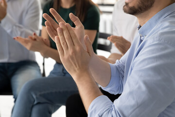 Businesspeople employees clapping hands express gratitude to trainer for presentation accomplish seminar close up view. Rehab group session encourage newcomer after telling personal life story concept