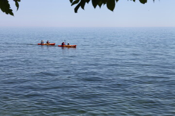 Naklejka premium WATER, KAYAK, SUMMER DAY, BLUE SKY, ROCK, SAND, 