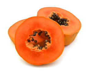 Papaya fruit sliced on half isolated on a white background.