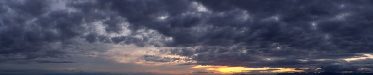 Beautiful Panoramic View of Cloudscape during a colorful sunset or sunrise. Taken on the West Coast of British Columbia, Canada.