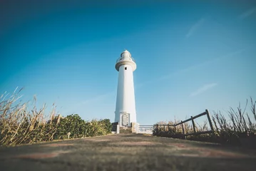 Wandcirkels aluminium lighthouse on the coast © Yuandong