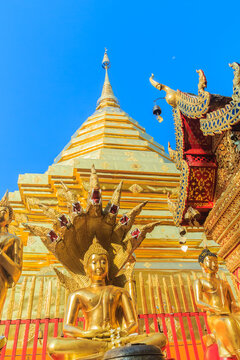 Beautiful northern Thai style architectural of golden pagoda and golden Buddha Image at Wat Phra That Doi Suthep, the famous temple and became the landmark of Chiang Mai, Thailand.