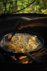 traditional Argentine food, flour dough filled with cheese or sweet, cooked by frying