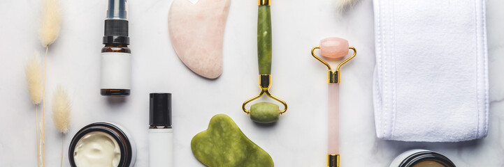 Jade face rollers and Gua sha stones for beauty facial massage therapy, Items for home treatment with Skin Care Anti-Aging Tools, Headband, Face Serum, Coconut Oil and Moisturiser Cream