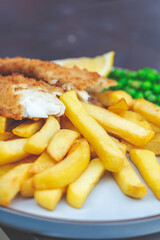Traditional English Food such as Fish and Chips with green peas served in the Pub or Restaurant