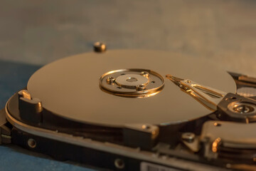 Disassembled hard drive from the computer, hdd with mirror effect. Opened hard drive from the...