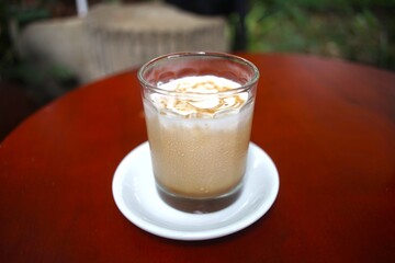 Iced Latte coffee in a grass
