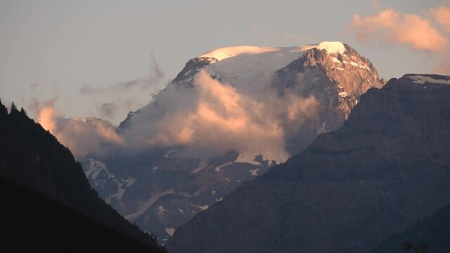 Clouds passing by and around Mount Todi in the Glarus alps in Switzerland