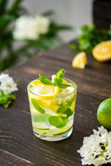 Refreshing drink with lemon, lime and mint, lemonade with ice