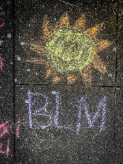 Black Lives Matter and sun shine sidewalk chalk work