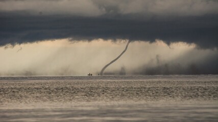 Upcoming storm with tornado hitting the water at lake malawi