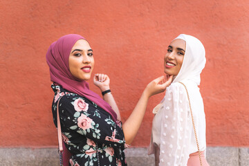 Beautiful Arab Girls Having fun Outdoors. Friendship Concept.