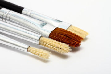 selection of artists bristle paint brushes isolated on white