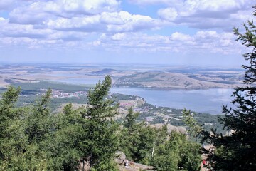 Fototapeta premium Perfect summer landscape. A field with a mountain in the background. Top view