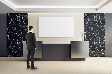 Businessman standing luxury hotel hall