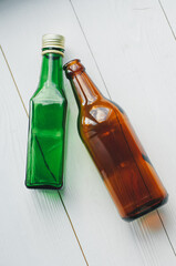 Beer bottles on a wooden table . Top view